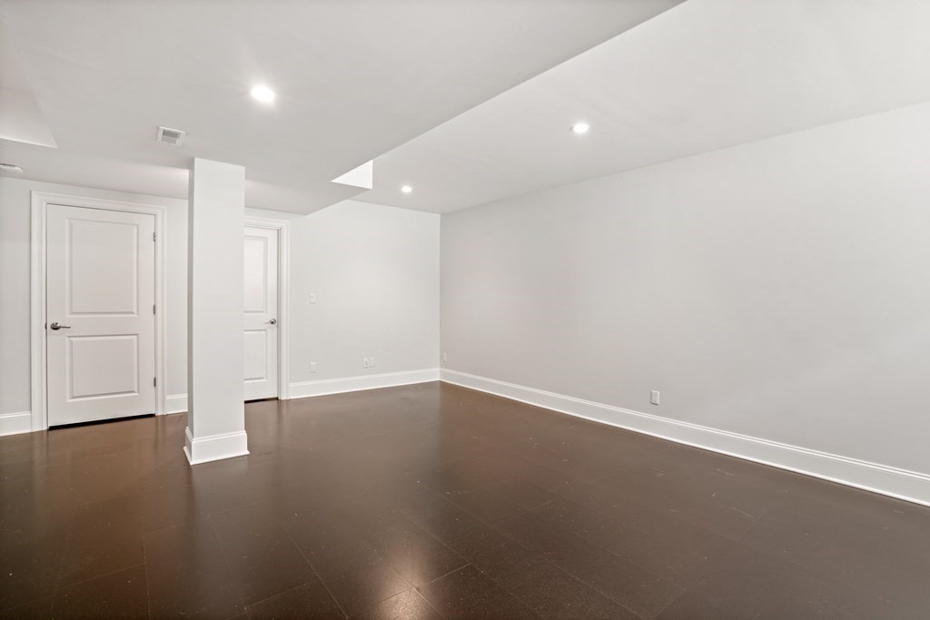 38 Wendell Road Newton, MA 02459 - Photo 34 of 42 an empty room with wooden floor and windows