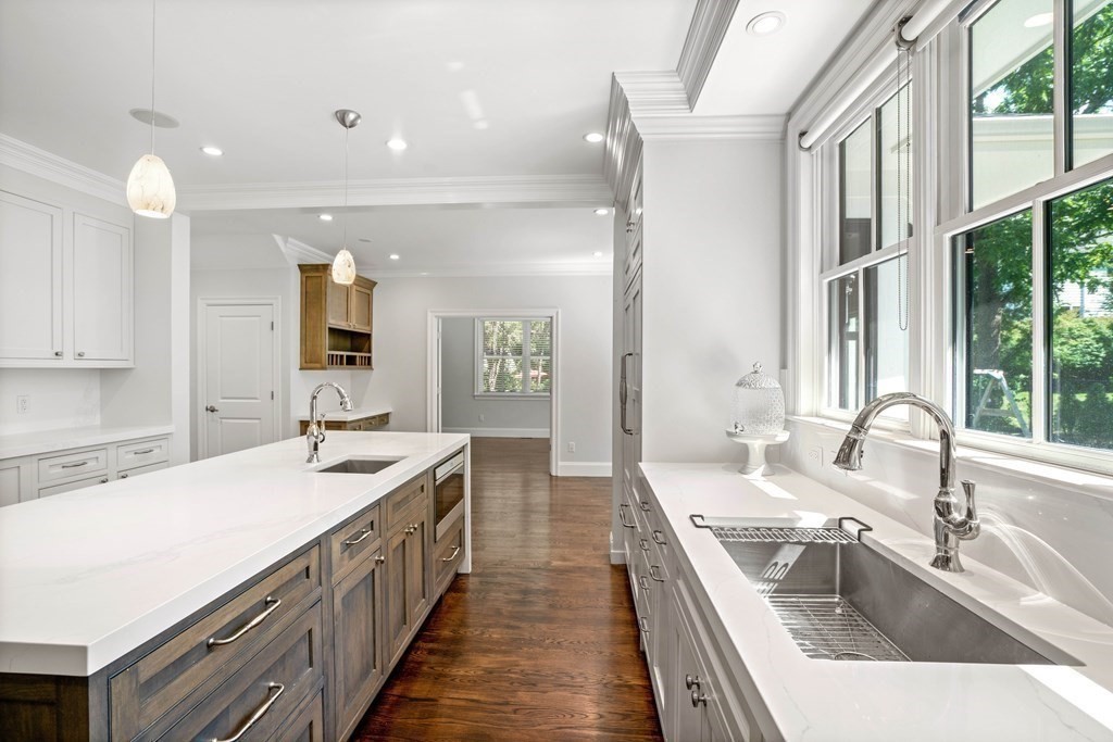 38 Wendell Road Newton, MA 02459 - Photo 7 of 42 a kitchen with sink stove and cabinets