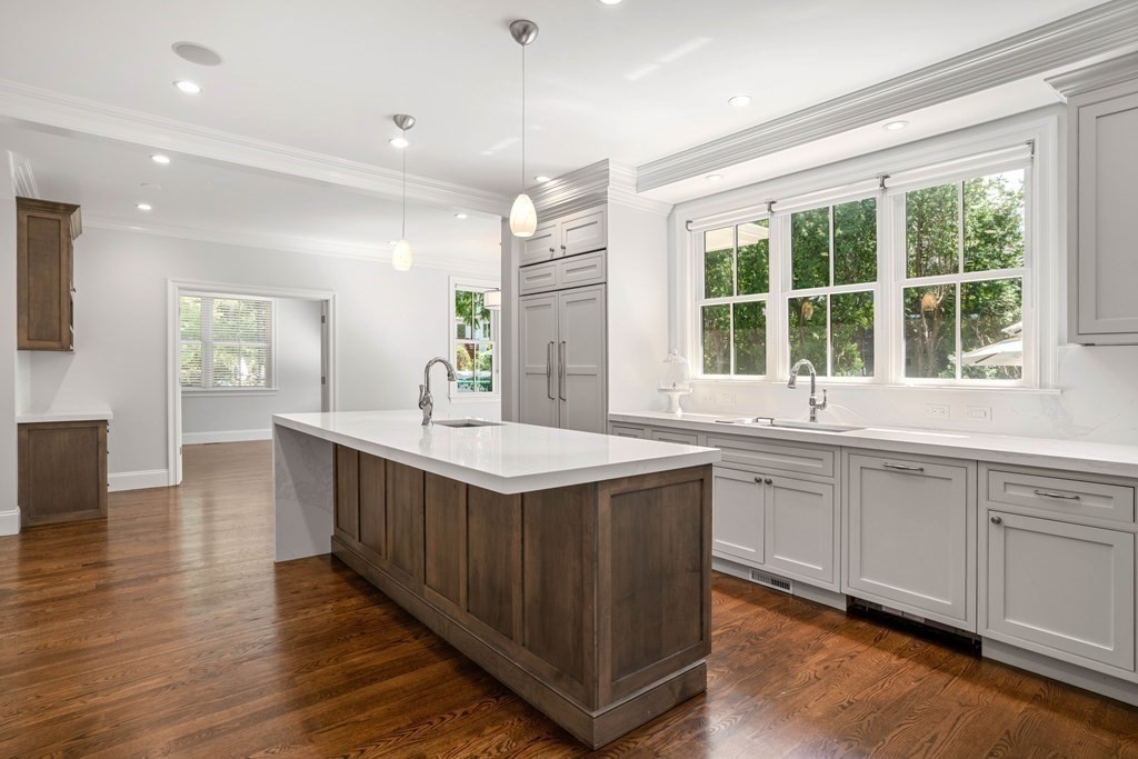 38 Wendell Road Newton, MA 02459 - Photo 9 of 42 a kitchen with stainless steel appliances granite countertop a sink and a wooden floors