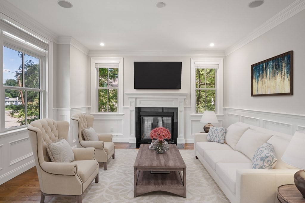 38 Wendell Road Newton, MA 02459 - Photo 10 of 42 a living room with furniture mirror and a fireplace
