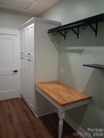 a view of a balcony with wooden floor