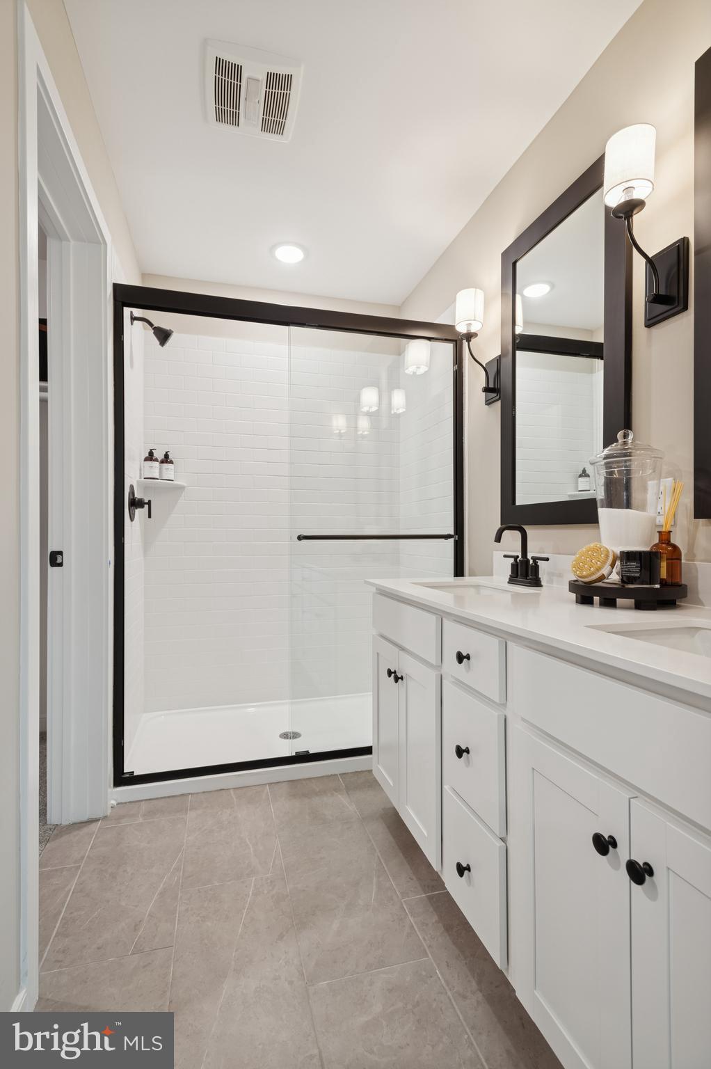 57 Sweetgum Road, Unit 33 Berlin, NJ 08009 - Photo 14 of 38 a bathroom with a double vanity sink mirror and double