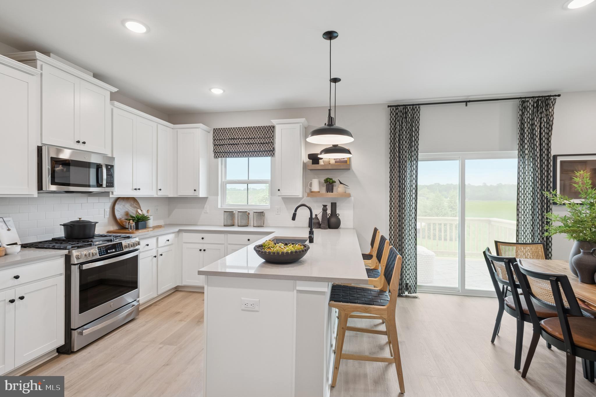 57 Sweetgum Road, Unit 33 Berlin, NJ 08009 - Photo 29 of 38 a kitchen with a stove a refrigerator and a wooden floor