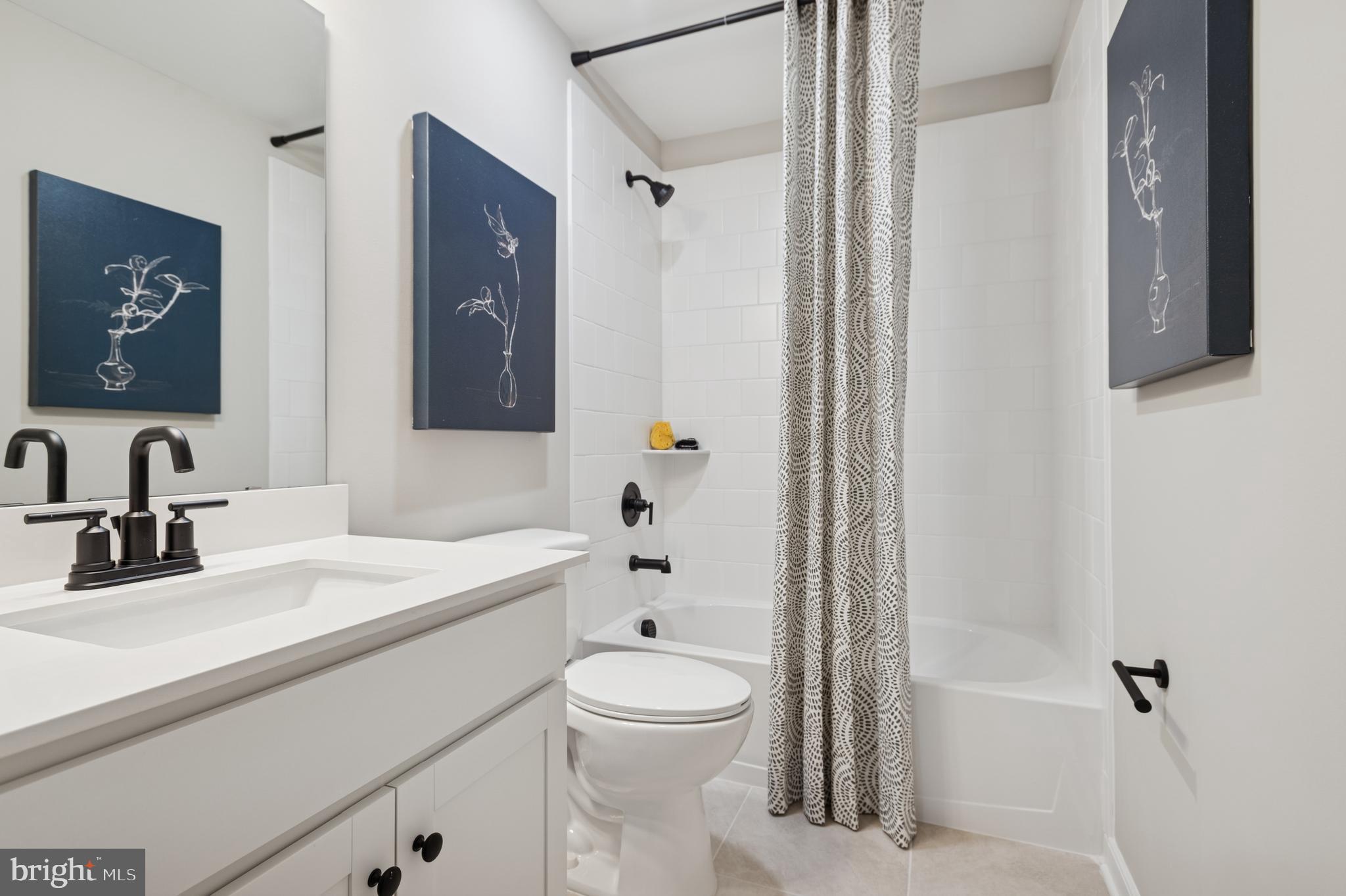 57 Sweetgum Road, Unit 33 Berlin, NJ 08009 - Photo 37 of 38 a bathroom with a sink a toilet and shower