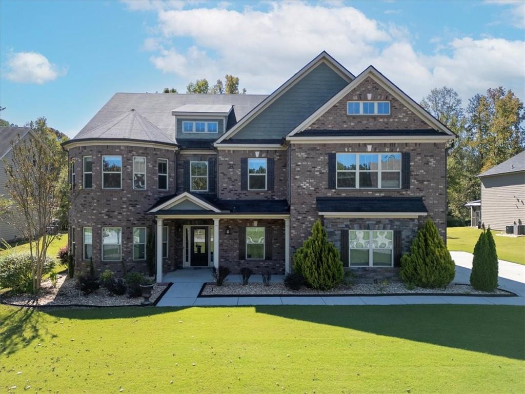 2368 Beringer Lane Powder Springs, GA 30127 - Photo 1 of 59 a front view of a house with swimming pool and porch