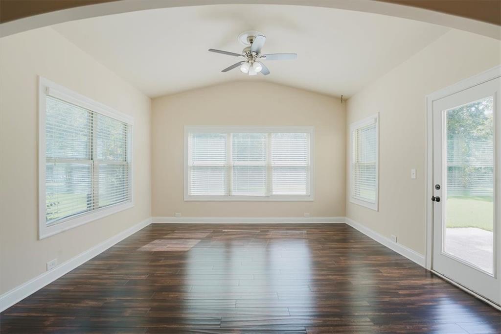 2368 Beringer Lane Powder Springs, GA 30127 - Photo 17 of 59 an empty room with wooden floor and windows