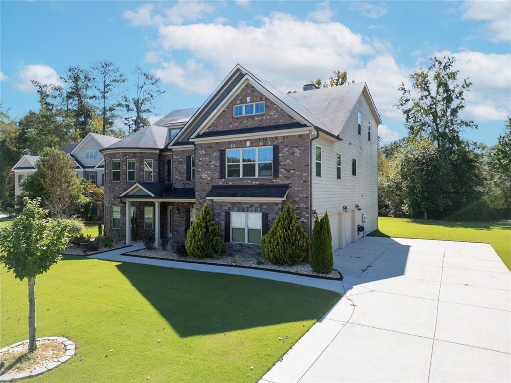 2368 Beringer Lane Powder Springs, GA 30127 - Photo 2 of 59 a view of house with garden space and swimming pool