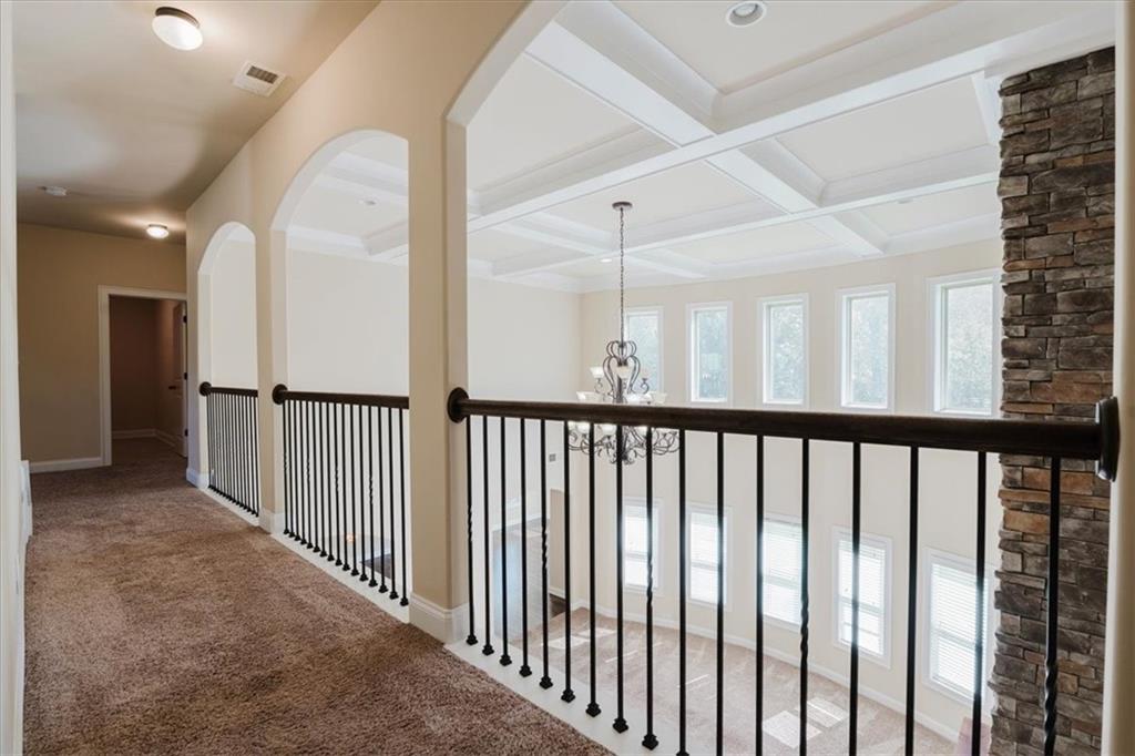 2368 Beringer Lane Powder Springs, GA 30127 - Photo 28 of 59 a view of a hallway with a large window and stairs