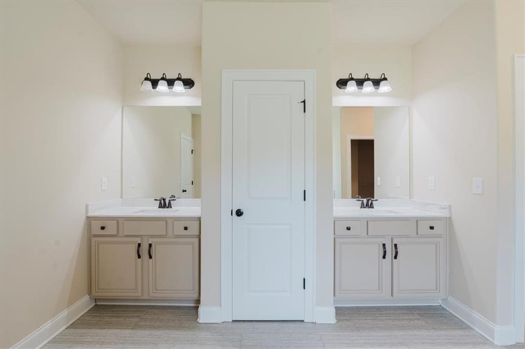 2368 Beringer Lane Powder Springs, GA 30127 - Photo 34 of 59 a view of an entryway with wooden cabinet