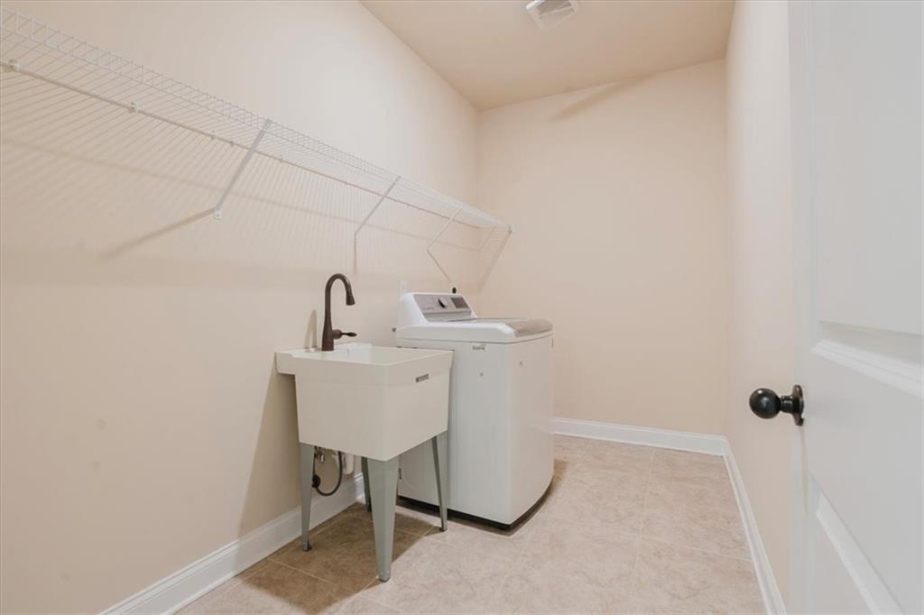 2368 Beringer Lane Powder Springs, GA 30127 - Photo 41 of 59 a bathroom with a sink and a mirror