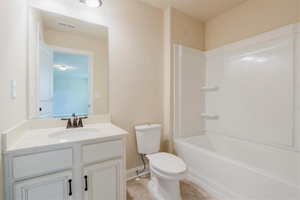 2368 Beringer Lane Powder Springs, GA 30127 - Photo 45 of 59 a bathroom with a sink toilet and shower