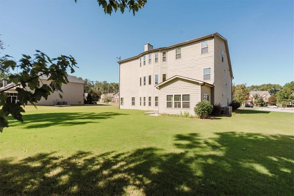 2368 Beringer Lane Powder Springs, GA 30127 - Photo 53 of 59 a view of a house with a big yard