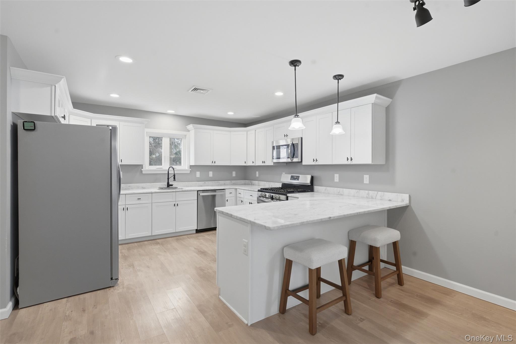 1227 Burlingham Road Pine Bush, NY 12566 - Photo 19 of 39 Kitchen featuring stainless steel appliances, a kitchen breakfast bar, and island