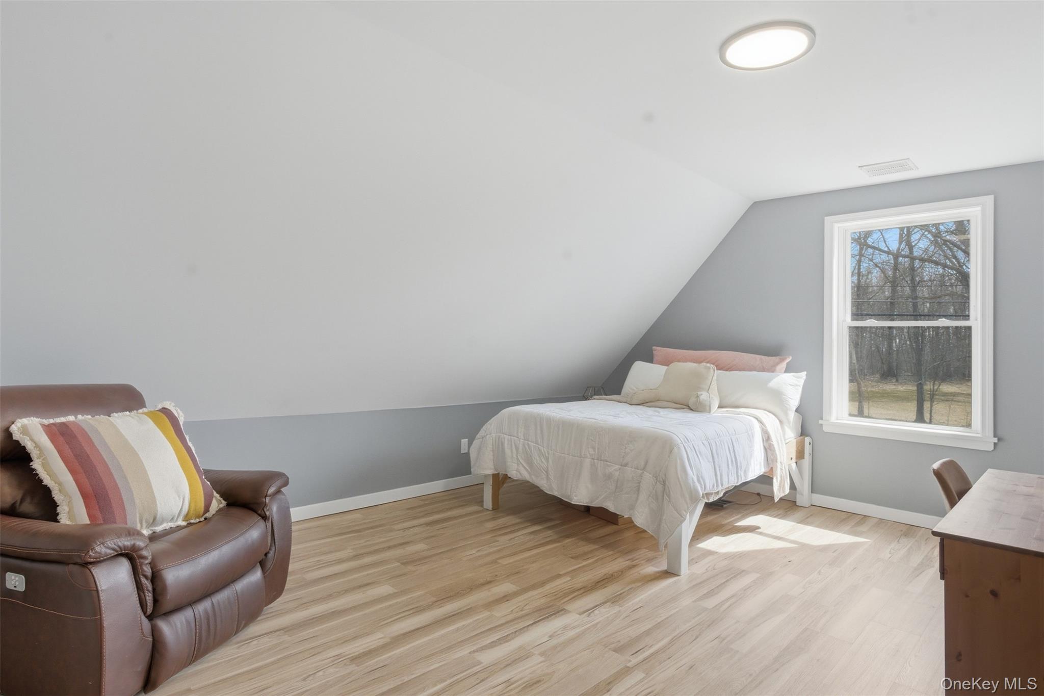 1227 Burlingham Road Pine Bush, NY 12566 - Photo 31 of 39 second upstairs bedroom with light wood-style floors and lofted ceiling