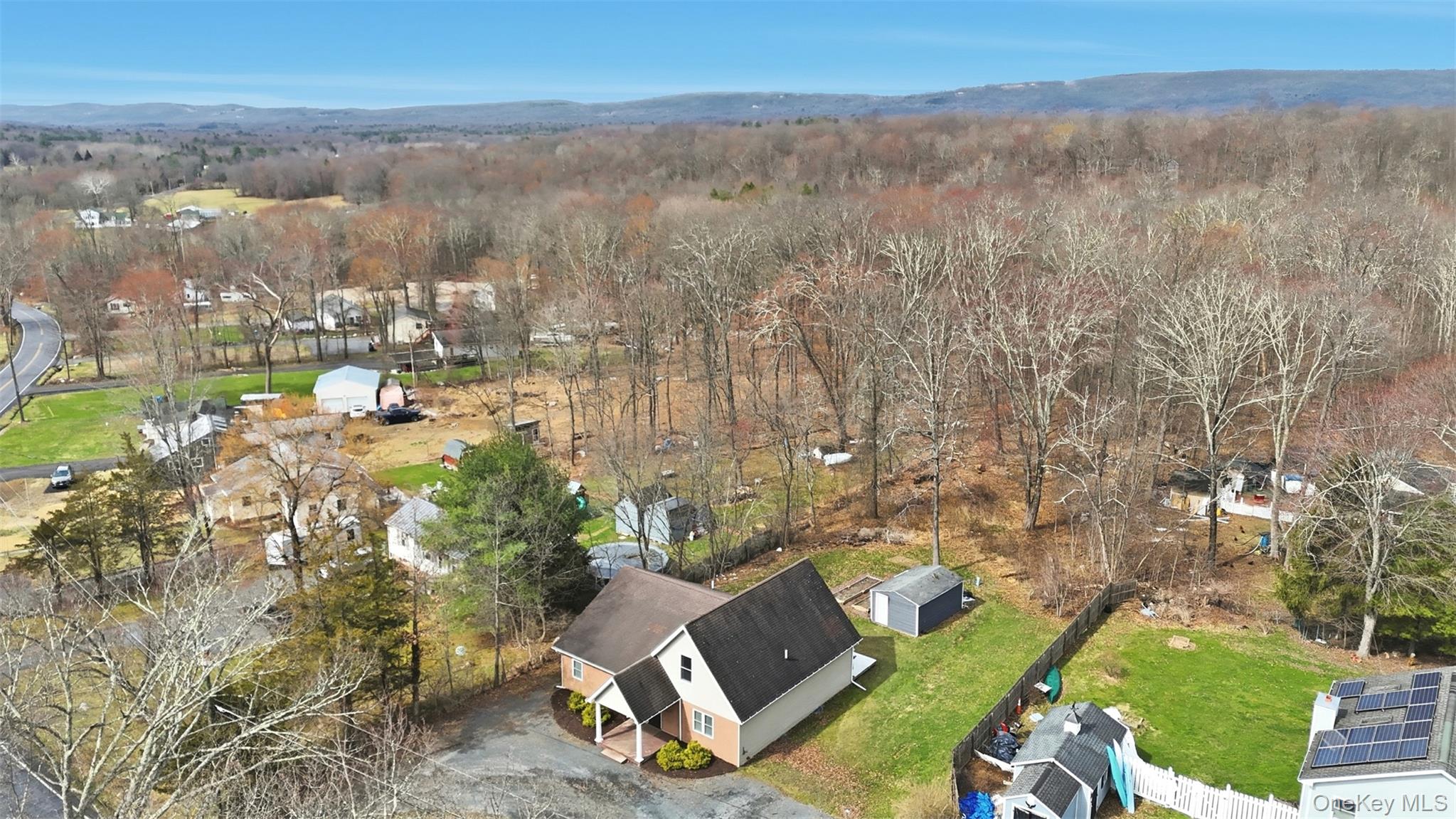 1227 Burlingham Road Pine Bush, NY 12566 - Photo 38 of 39 Aerial view of residential area with a mountainous background and a heavily wooded area