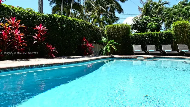 a view of swimming pool with a garden