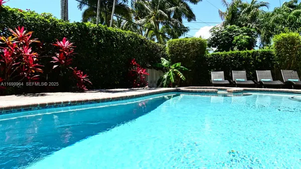 a view of swimming pool with a garden