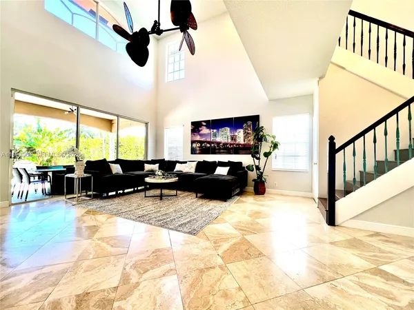 a living room with fireplace furniture and a flat screen tv