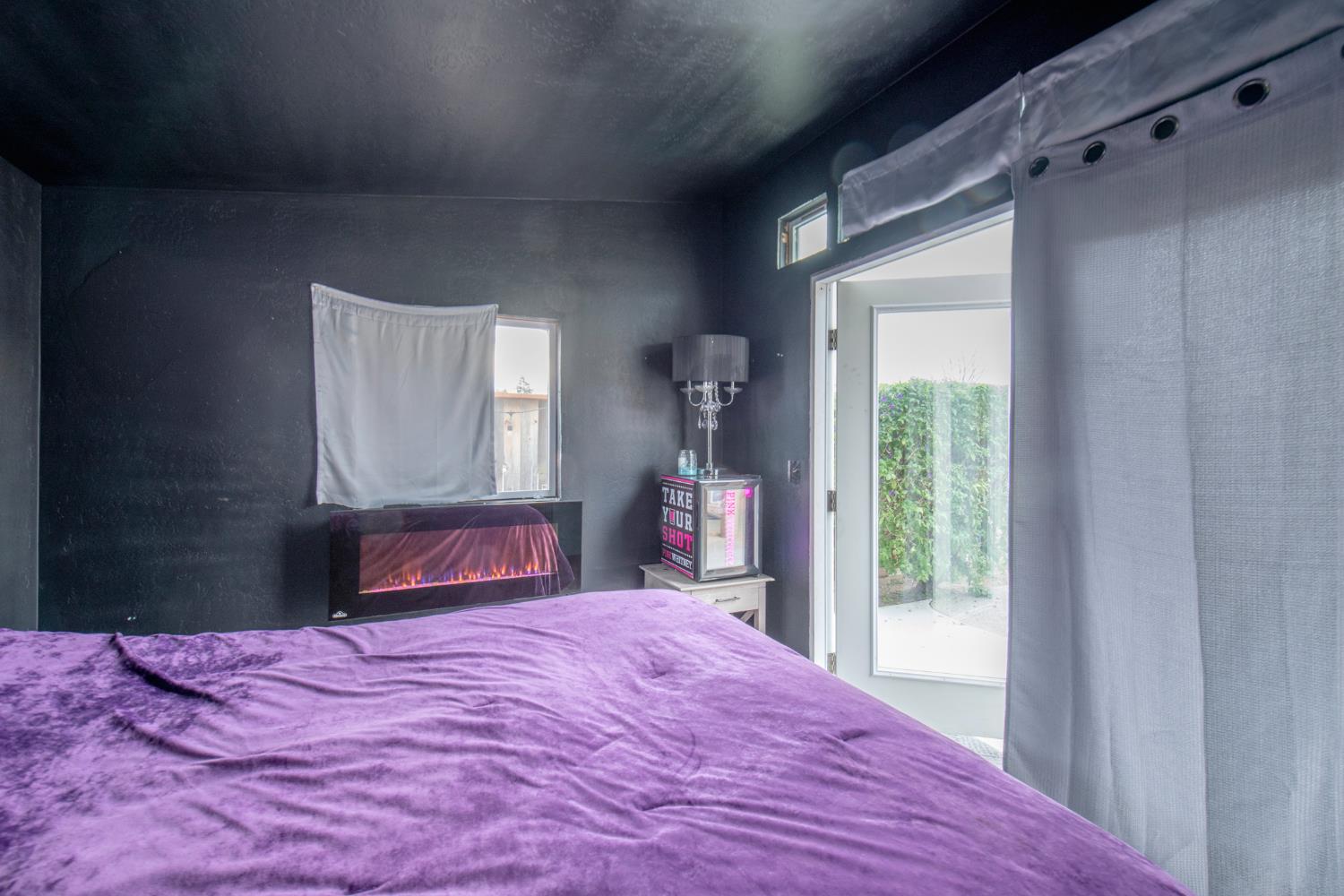 338 North Filbert Avenue Clovis, CA 93611 - Photo 28 of 33 a bedroom with a bed and a dresser