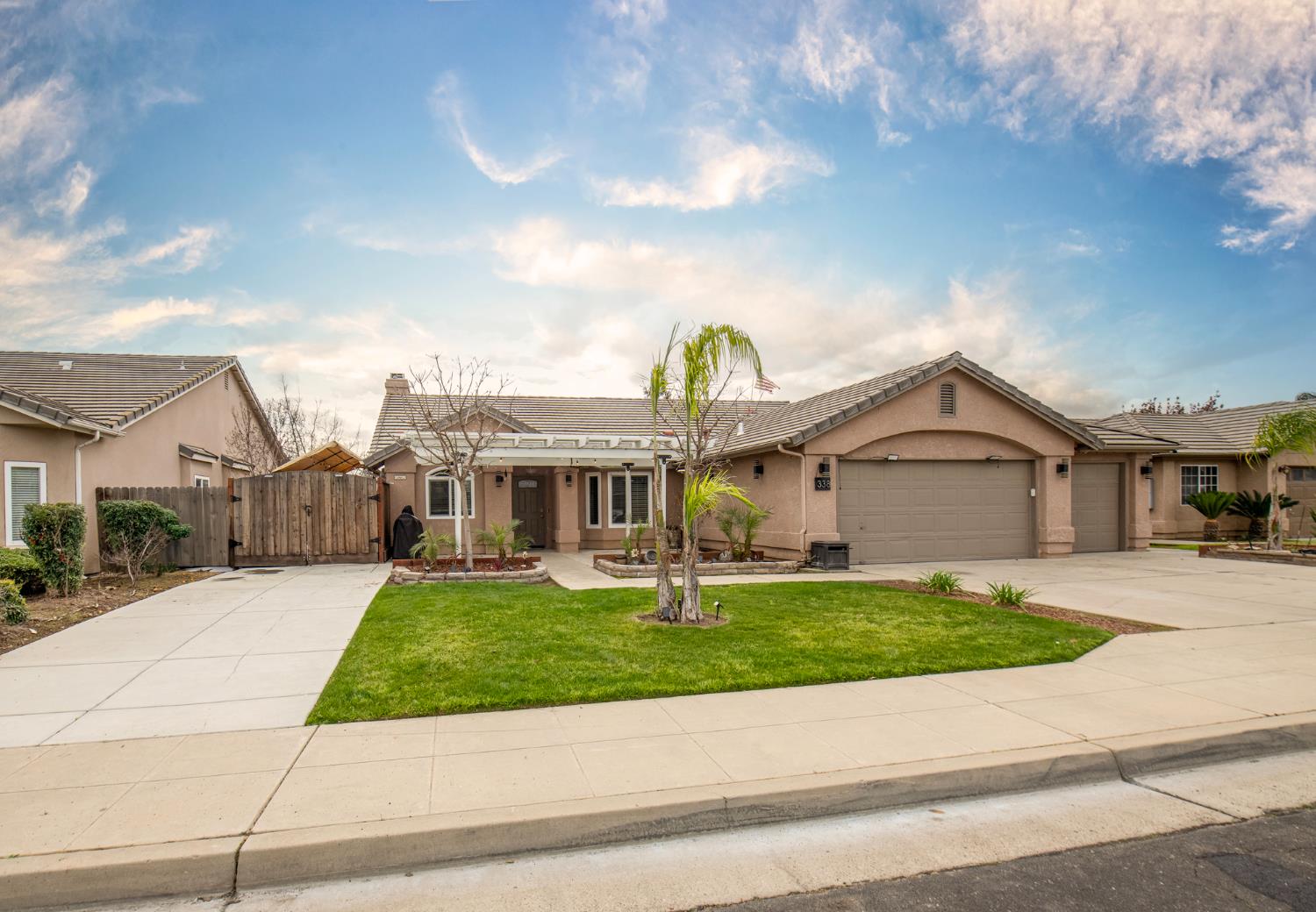 338 North Filbert Avenue Clovis, CA 93611 - Photo 5 of 33 a view of a house with a yard and large tree