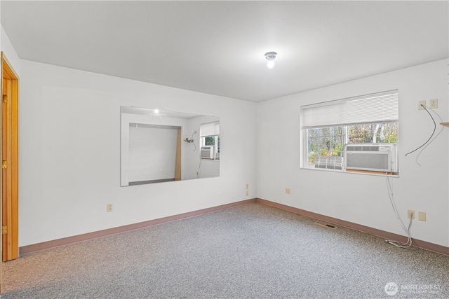 a view of empty room with windows