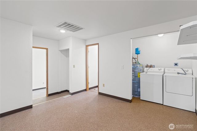 a view of a room with dryer and washer