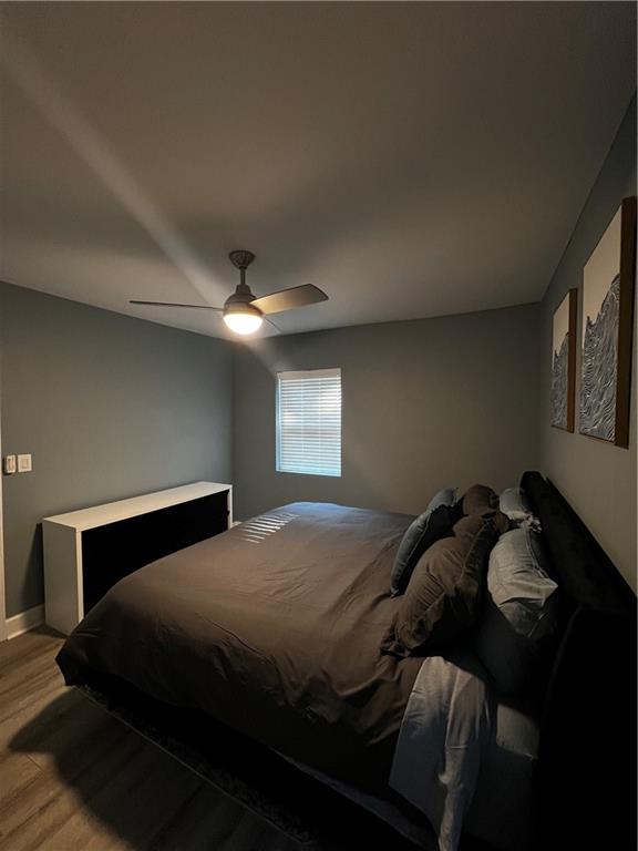 1780 John Calvin Avenue, Unit L Atlanta, GA 30337 - Photo 19 of 21 a bedroom with a bed and window