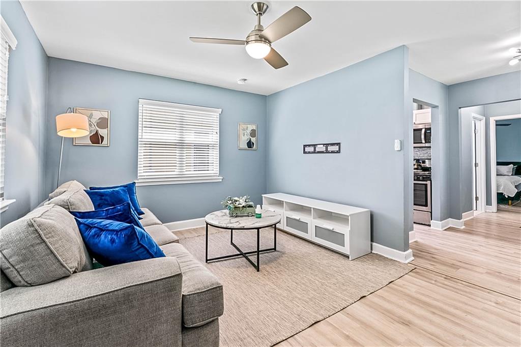 1780 John Calvin Avenue, Unit L Atlanta, GA 30337 - Photo 4 of 21 a living room with furniture and a window