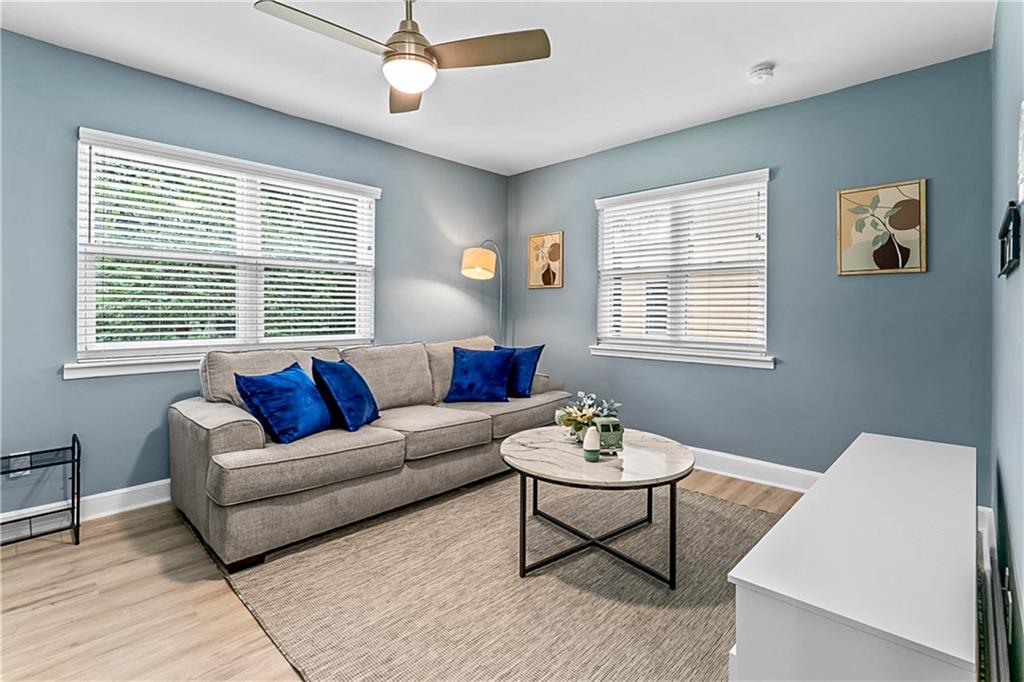 1780 John Calvin Avenue, Unit L Atlanta, GA 30337 - Photo 6 of 21 a living room with furniture and a window
