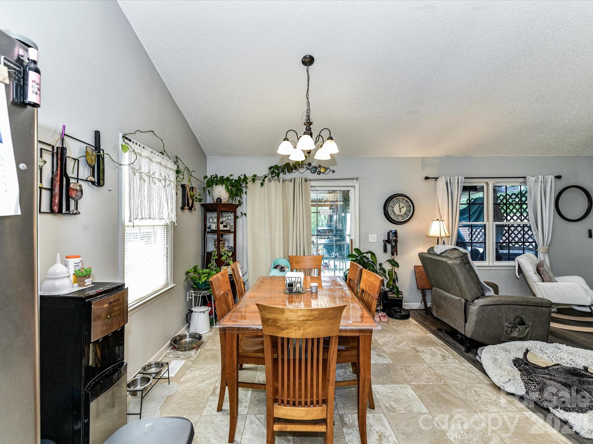 1472 Ridgewood Drive Concord, NC 28027 - Photo 13 of 30 a dining room with furniture a chandelier and window