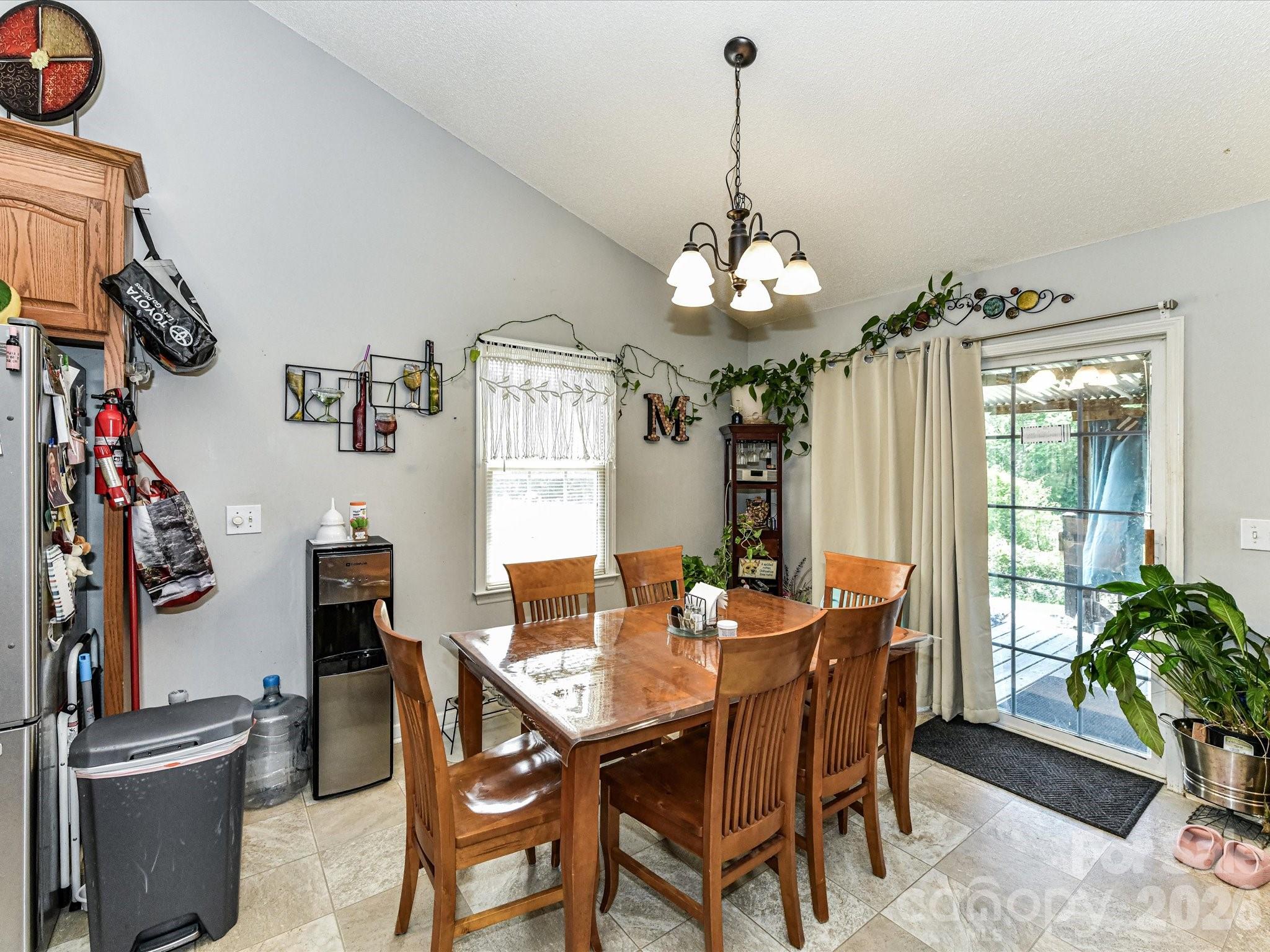 1472 Ridgewood Drive Concord, NC 28027 - Photo 14 of 30 a view of a dining room with furniture window and wooden floor