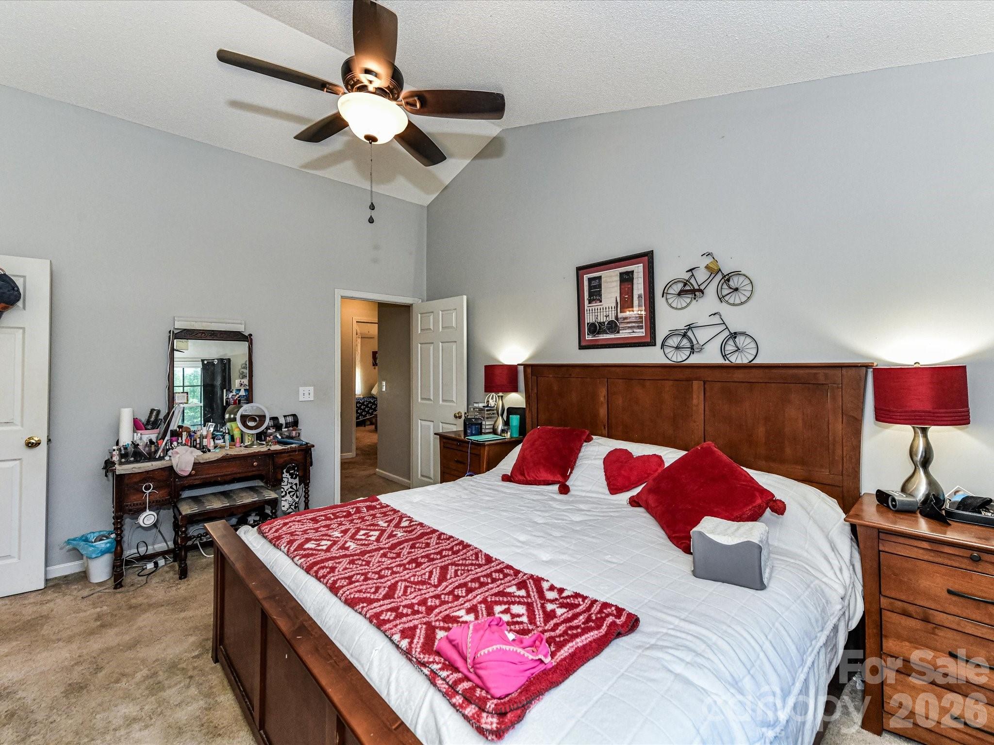 1472 Ridgewood Drive Concord, NC 28027 - Photo 16 of 30 a bedroom with a bed and a chandelier