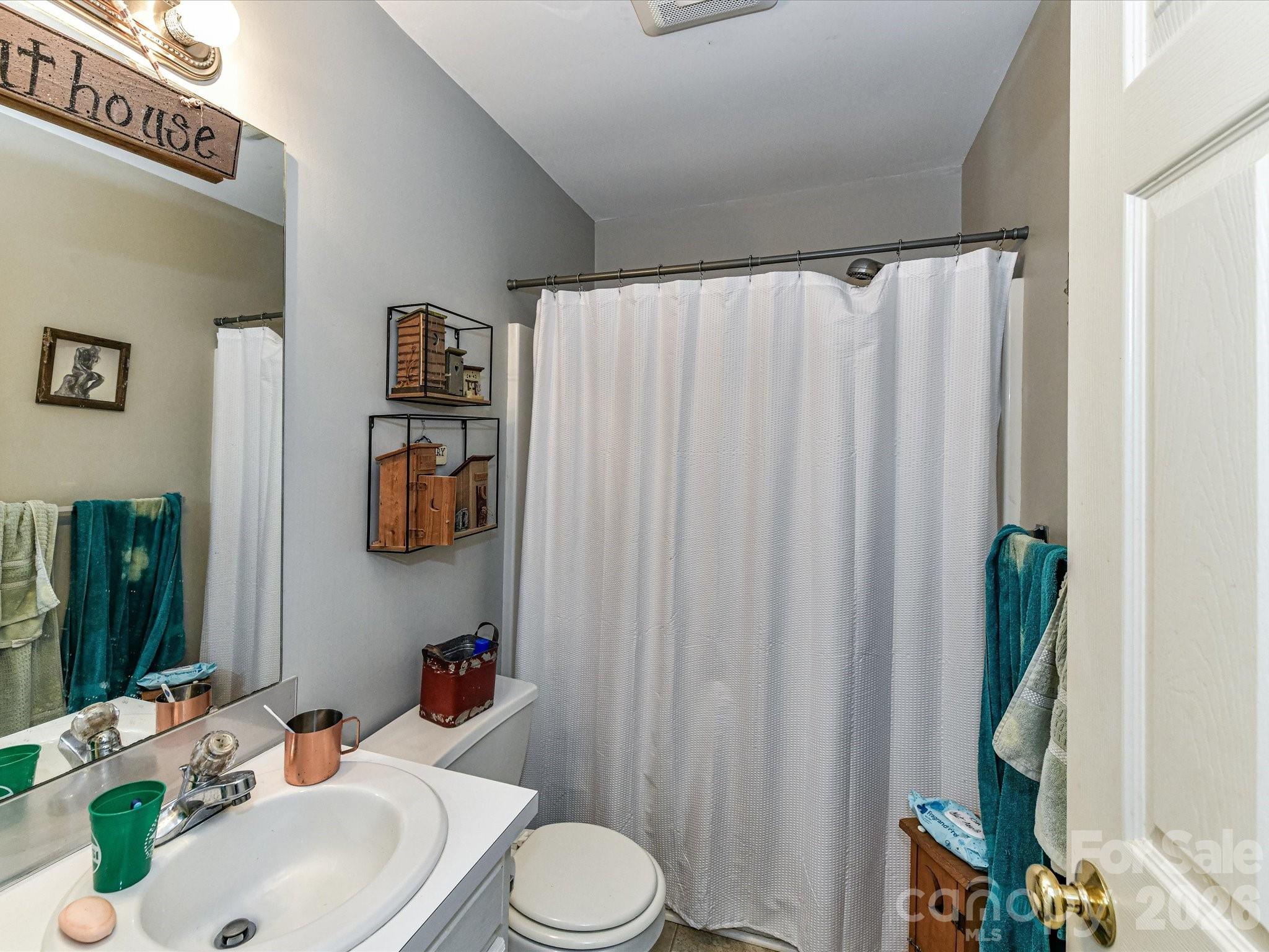 1472 Ridgewood Drive Concord, NC 28027 - Photo 17 of 30 a bathroom with a sink and a mirror