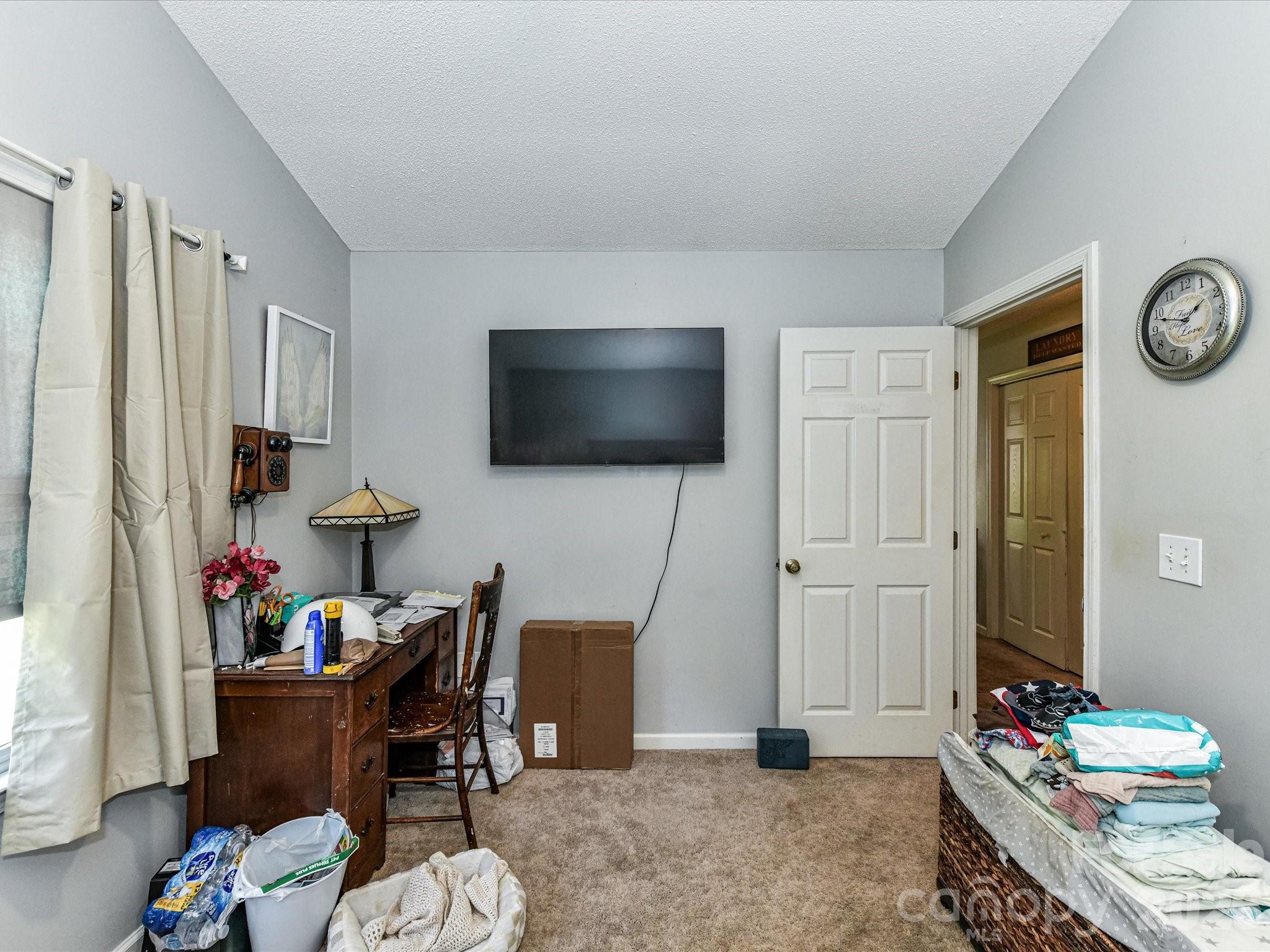 1472 Ridgewood Drive Concord, NC 28027 - Photo 19 of 30 a living room with furniture and a flat screen tv