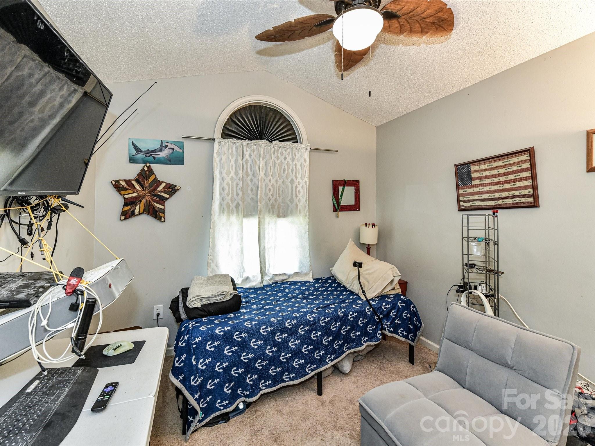 1472 Ridgewood Drive Concord, NC 28027 - Photo 20 of 30 a bedroom with a bed couch and window