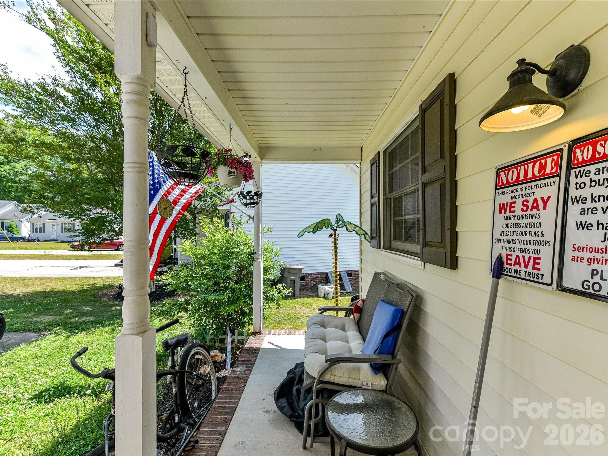 1472 Ridgewood Drive Concord, NC 28027 - Photo 6 of 30 a view of a chairs and tables in the patio with a barbeque