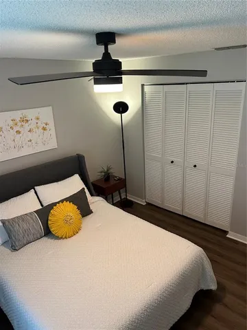 a bathroom with a toilet and shower