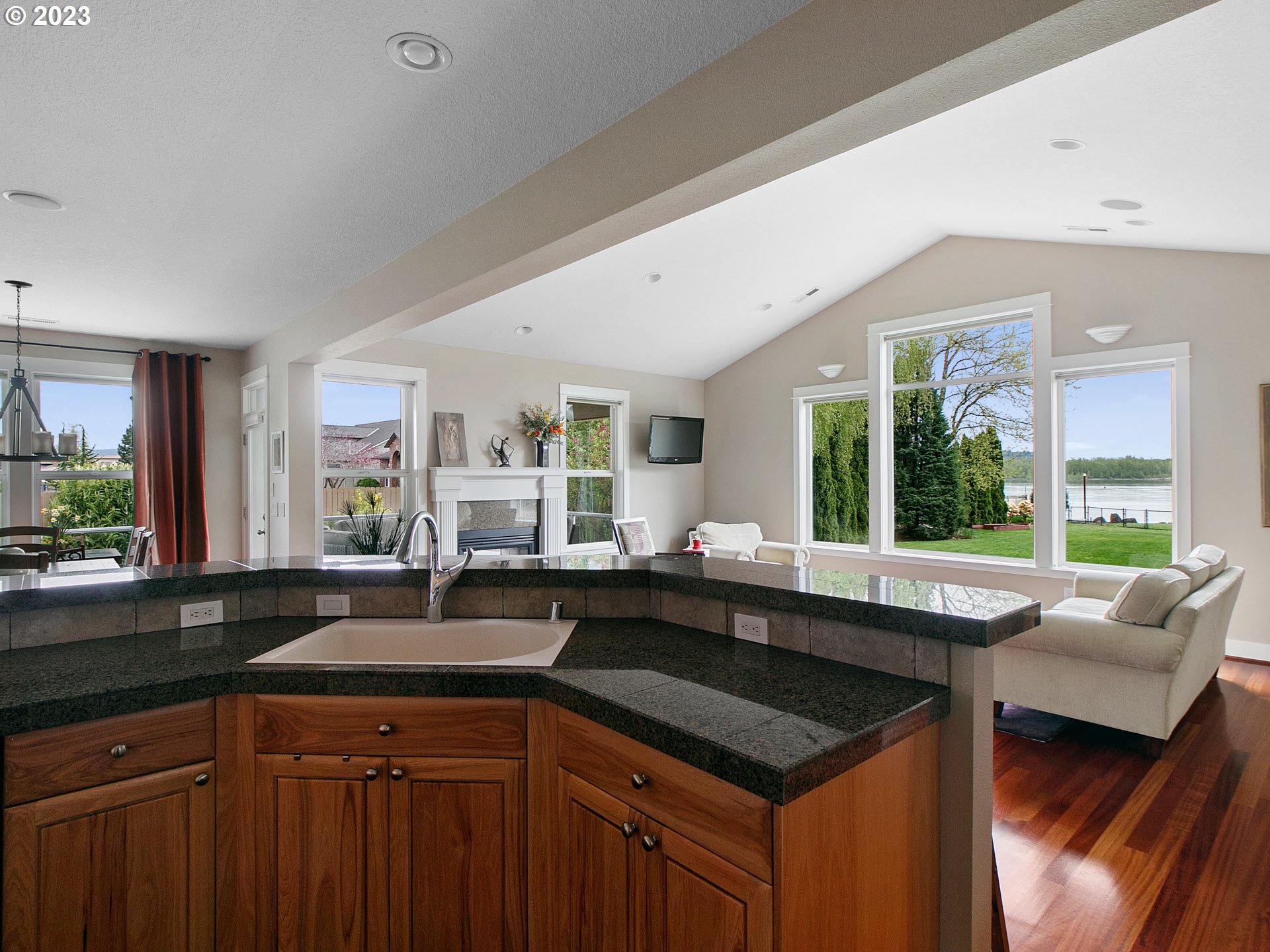 1156 Southeast Polk Street Camas, WA 98607 - Photo 15 of 34 a kitchen with granite countertop a sink and a stove