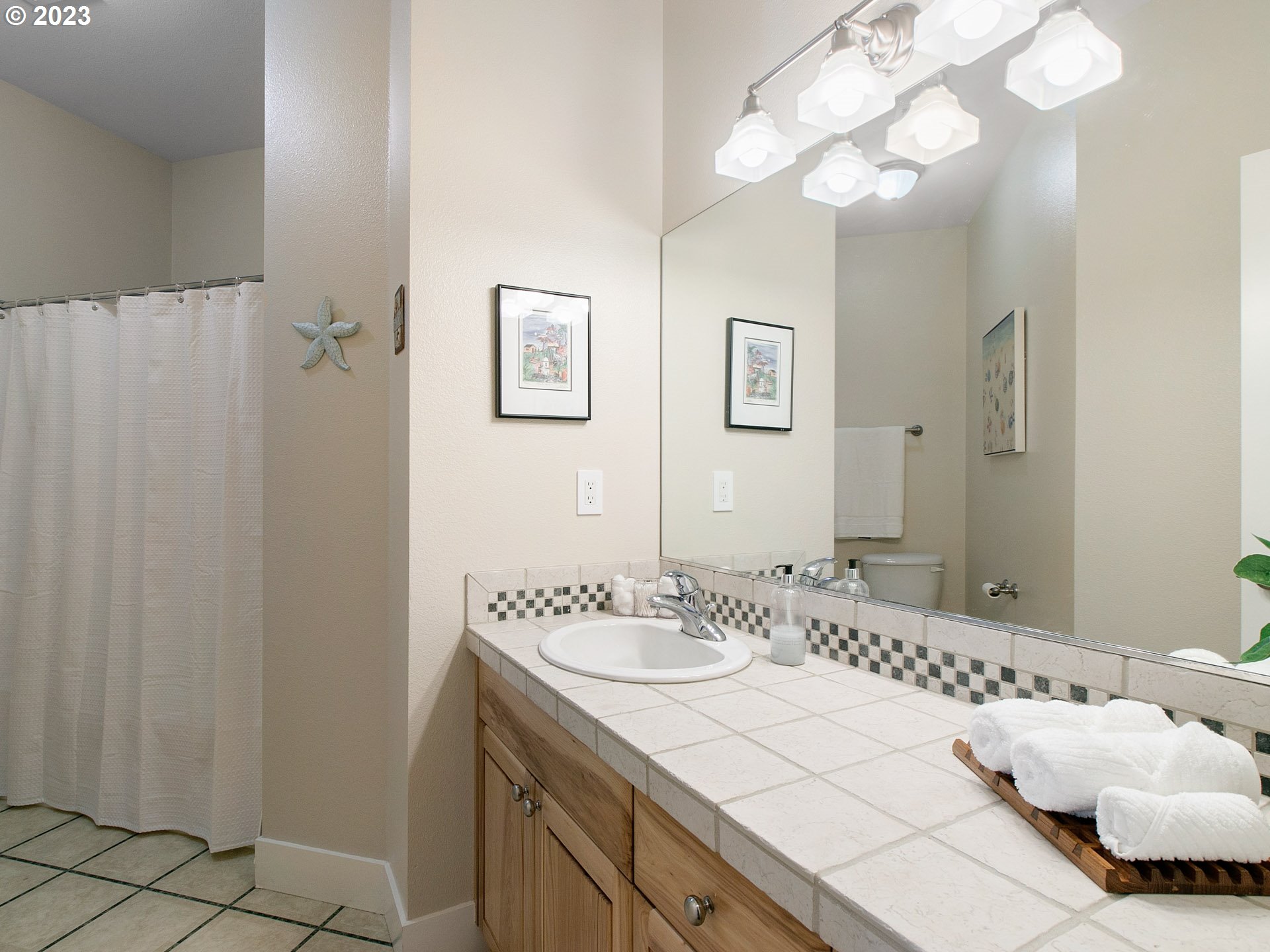 1156 Southeast Polk Street Camas, WA 98607 - Photo 22 of 34 a bathroom with a sink vanity and a mirror