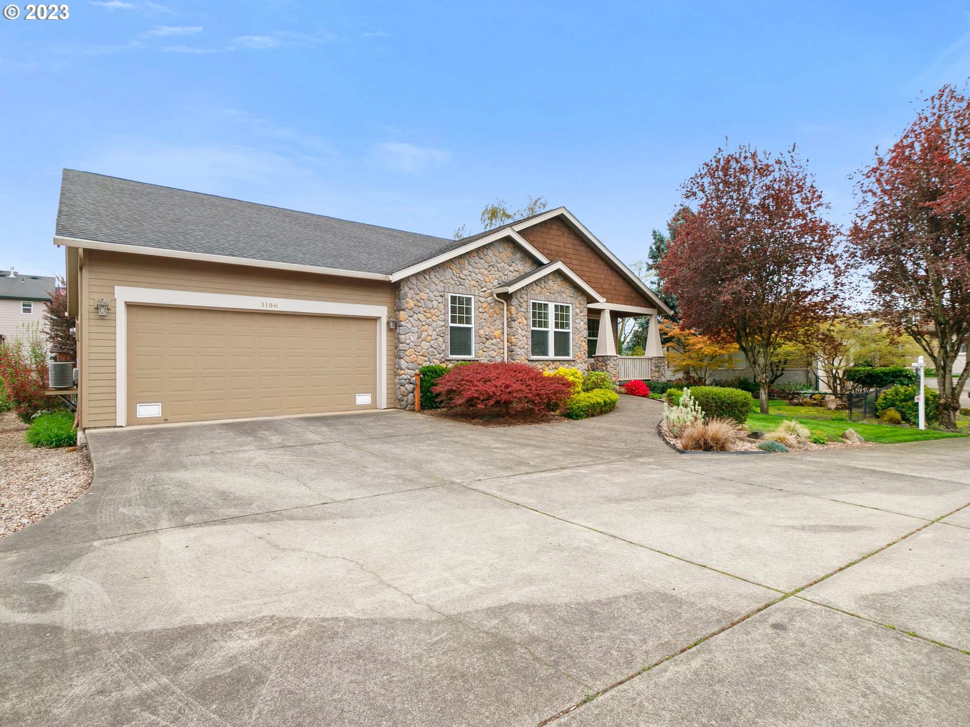 1156 Southeast Polk Street Camas, WA 98607 - Photo 30 of 34 a front view of a house with a yard and garage