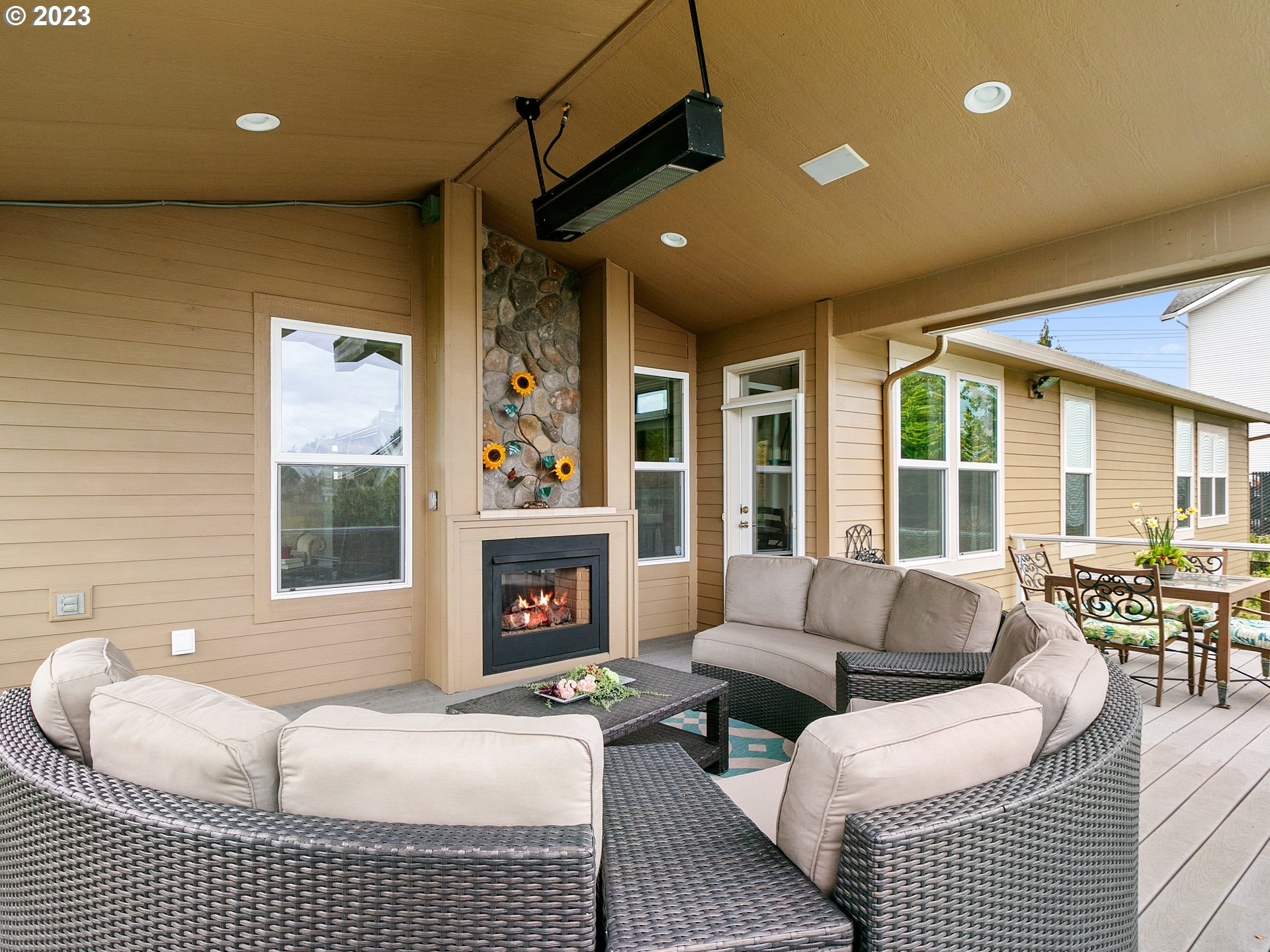 1156 Southeast Polk Street Camas, WA 98607 - Photo 3 of 34 a spacious bedroom with a balcony a bed and a couch