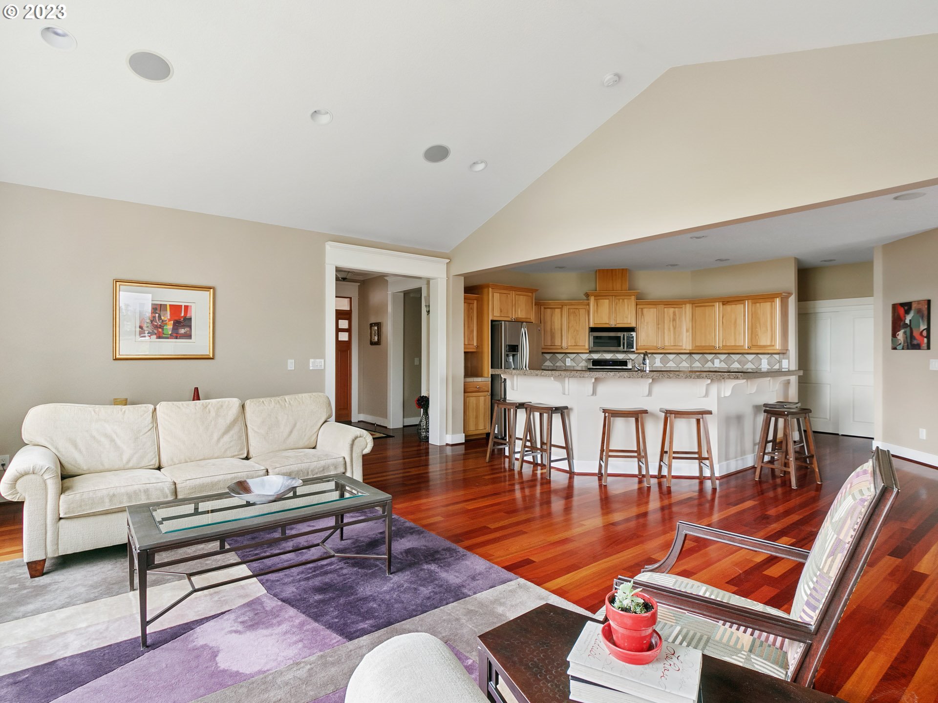 1156 Southeast Polk Street Camas, WA 98607 - Photo 9 of 34 a living room with furniture kitchen view and a wooden floor
