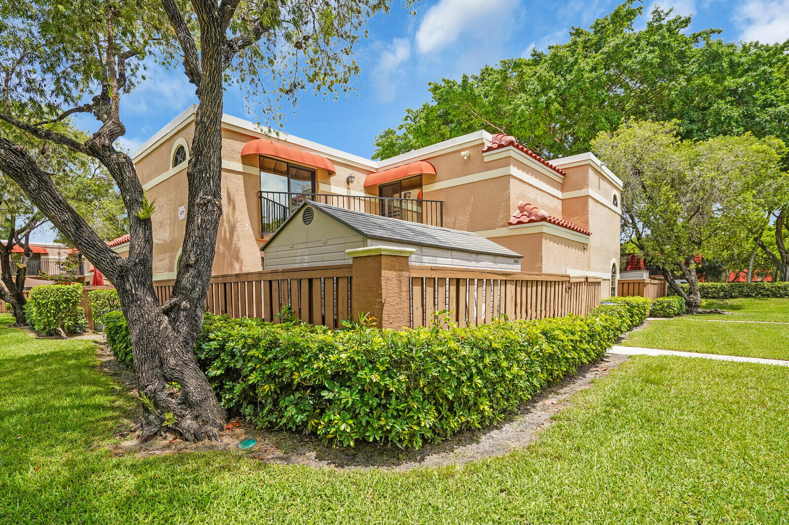 8291 Thames Boulevard, Unit C Boca Raton, FL 33433 - Photo 1 of 20 a front view of a house with a yard