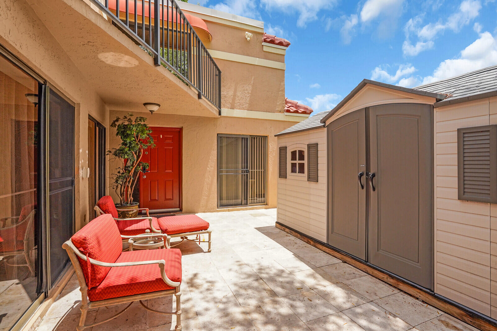 8291 Thames Boulevard, Unit C Boca Raton, FL 33433 - Photo 13 of 20 a view of a chairs in front of house