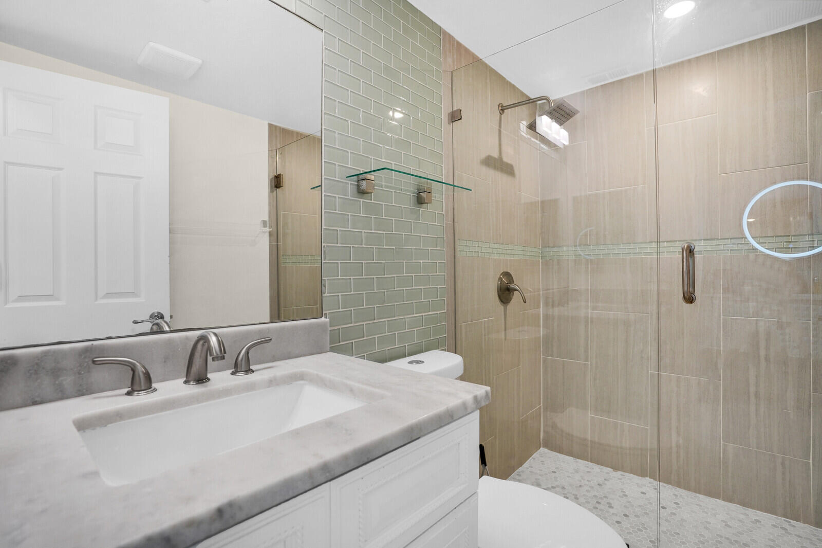 8291 Thames Boulevard, Unit C Boca Raton, FL 33433 - Photo 14 of 20 a bathroom with a sink a toilet and shower