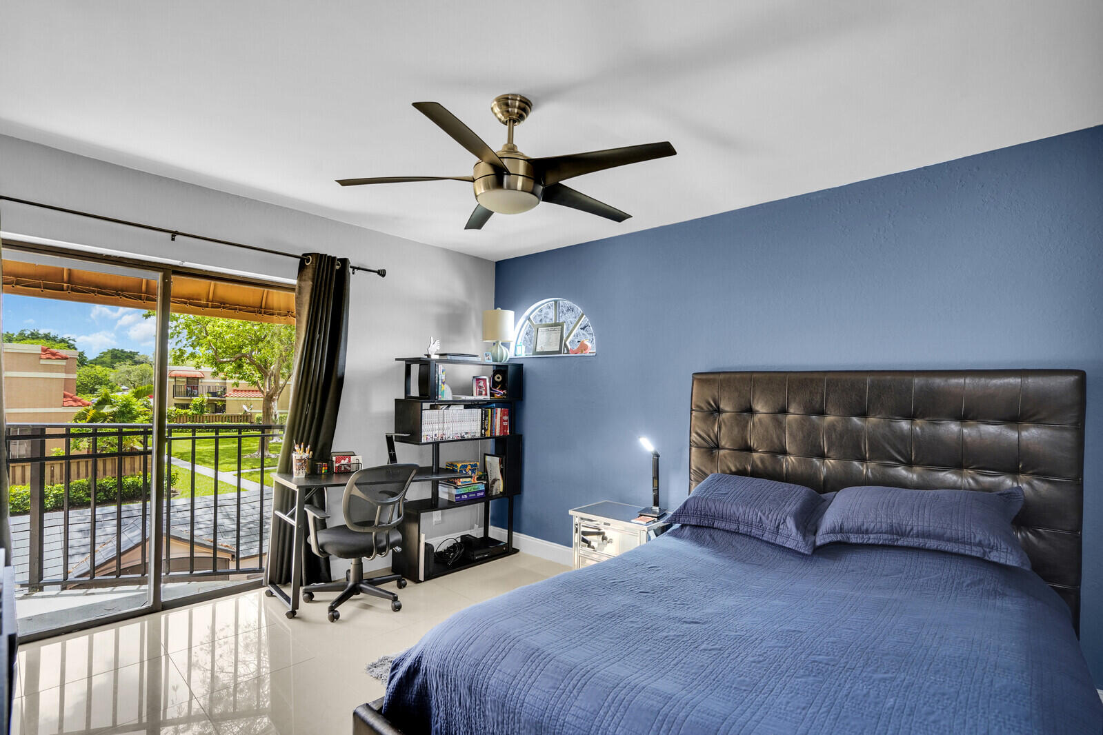 8291 Thames Boulevard, Unit C Boca Raton, FL 33433 - Photo 15 of 20 a living room with a couch and a large window