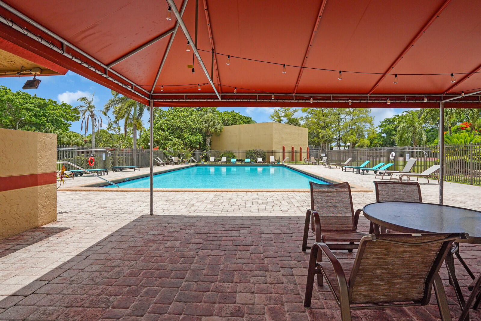 8291 Thames Boulevard, Unit C Boca Raton, FL 33433 - Photo 19 of 20 a patio with a yard