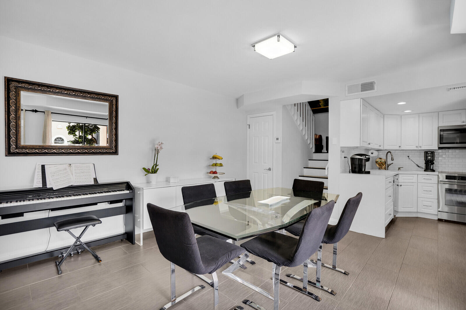 8291 Thames Boulevard, Unit C Boca Raton, FL 33433 - Photo 4 of 20 a view of a dining room with furniture