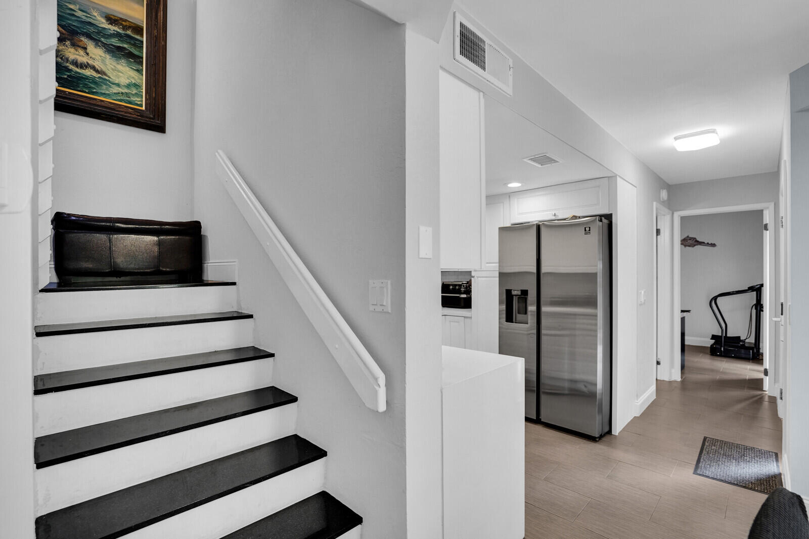 8291 Thames Boulevard, Unit C Boca Raton, FL 33433 - Photo 7 of 20 a view of entryway with microwave and refrigerator