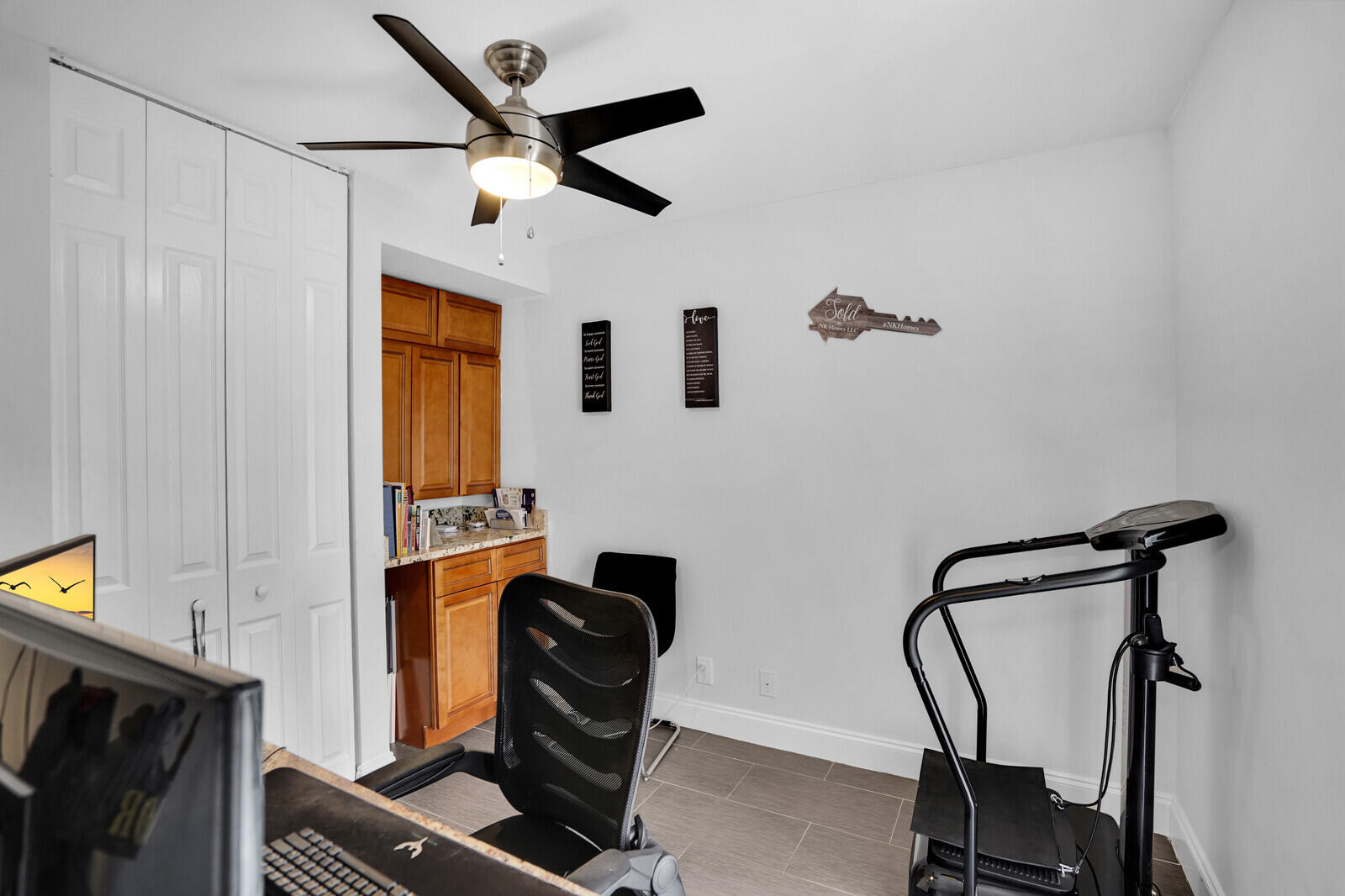 8291 Thames Boulevard, Unit C Boca Raton, FL 33433 - Photo 9 of 20 a room with gym equipment and windows